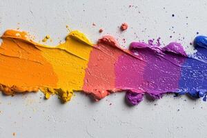 Vibrant rainbow paint strokes on white background photo