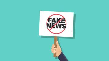 Hands holding notice boards and stop fake news video