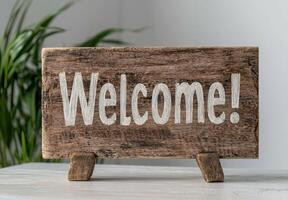 Rustic wooden welcome sign on a white table photo