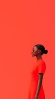A woman in a striking red outfit stands confidently, showcasing bold fashion choices photo