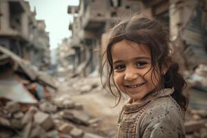A young girl smiles in front of rubble in a destroyed city photo