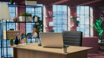Modern spacious studio with a clean layout and an inviting homey vibe, home office with gadgets and supplies. Stylish furniture with contemporary and minimalist interior, wooden floors. video