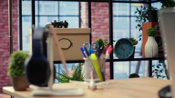 Modern spacious studio with a clean layout and an inviting homey vibe, home office with gadgets and supplies. Stylish furniture with contemporary and minimalist interior, wooden floors. video
