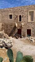 Stone structure in desert terrain, historical construction video