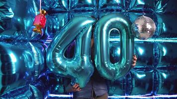 nombre 40 déjouer ballon sur une brillant fête Contexte fête anniversaire thème video