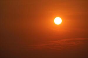 sunset back over red sky with clear orange cloud in the evening photo