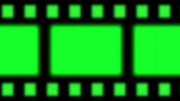 Schleifen von alt Kino Film Streifen auf Grün Hintergrund video
