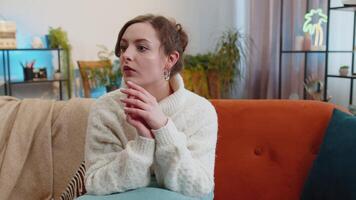 Thoughtful inspired young woman make Eureka gesture raises finger came up with creative plan at home video