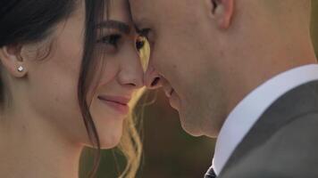 Portrait of lovely newlyweds caucasian bride embracing groom, wedding couple family hugging video